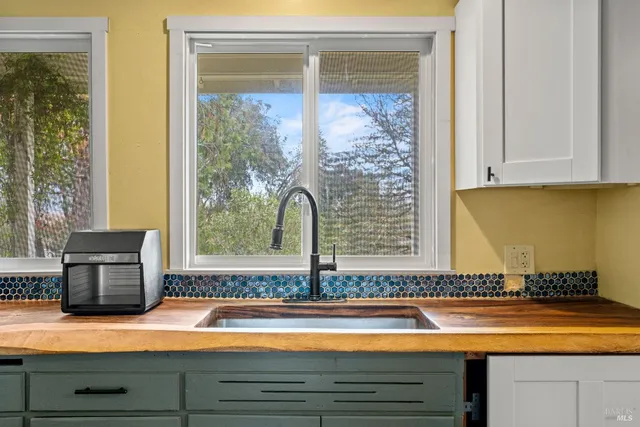 a bathroom with a tub and sink