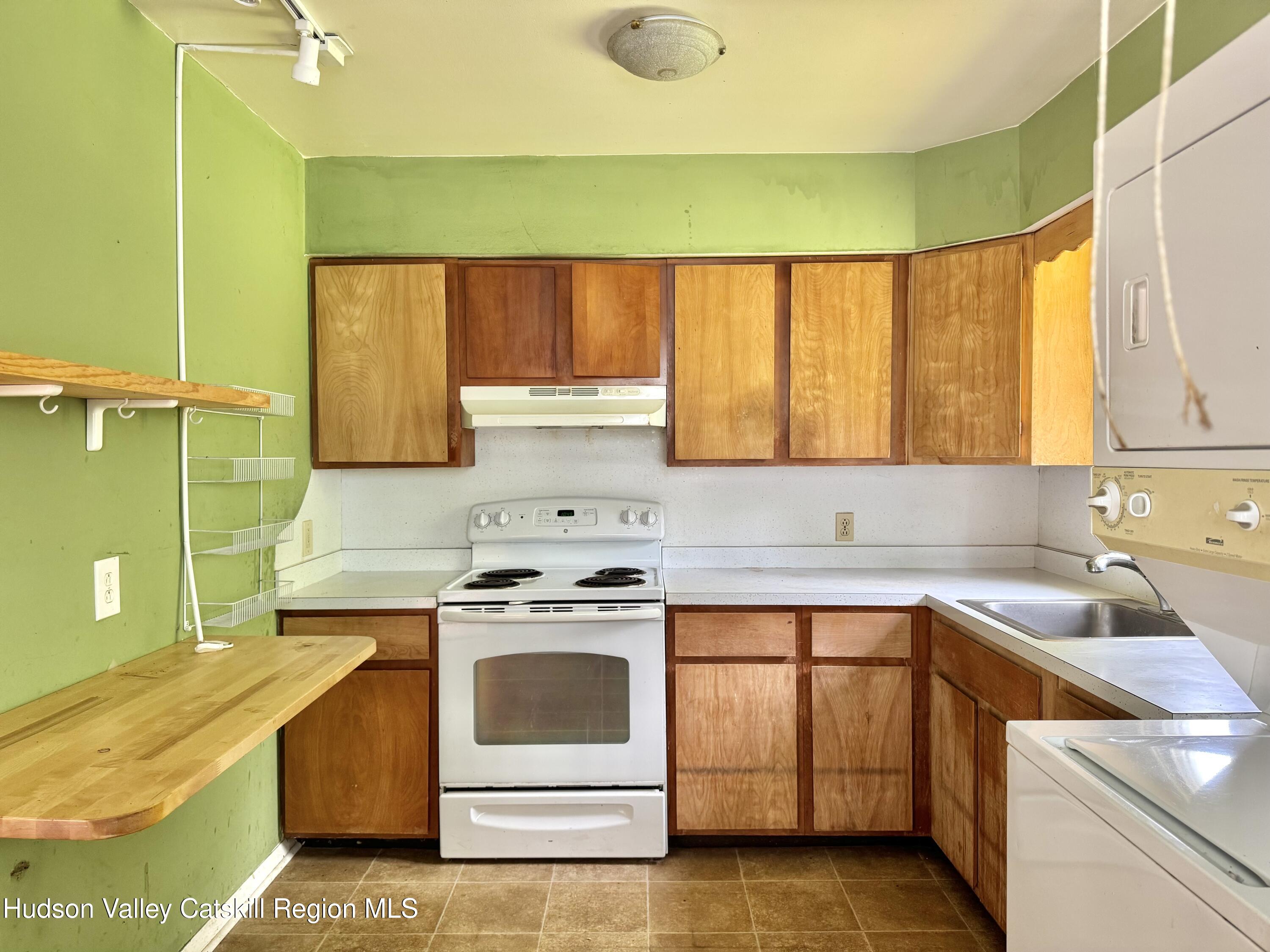 752 Old Rte 23 Acra, NY 12405 - Photo 8 of 25 a kitchen with a sink stove and cabinets