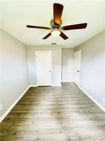 a view of room and a ceiling fan