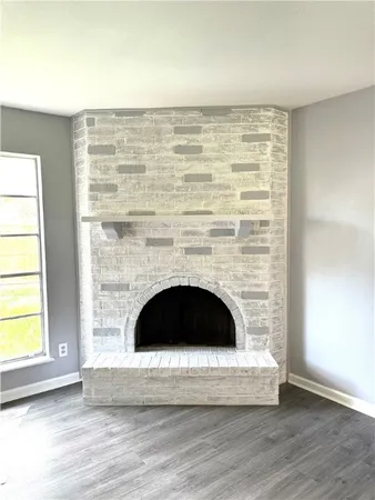 a living room with a fireplace and a table