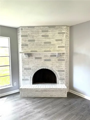 a living room with a fireplace and a table