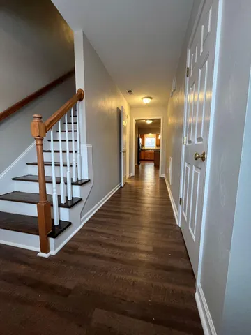 a view of entryway with wooden floor