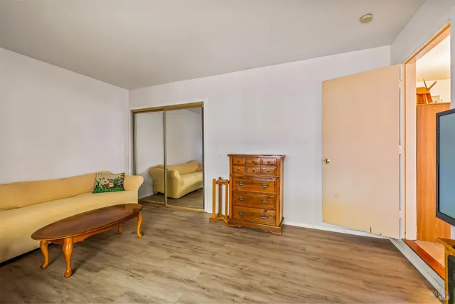 a bedroom with furniture and a window