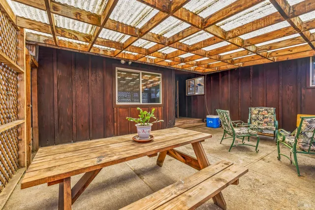 a view of a backyard with sitting area