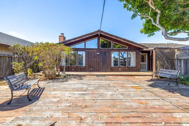 a house with trees in front of it