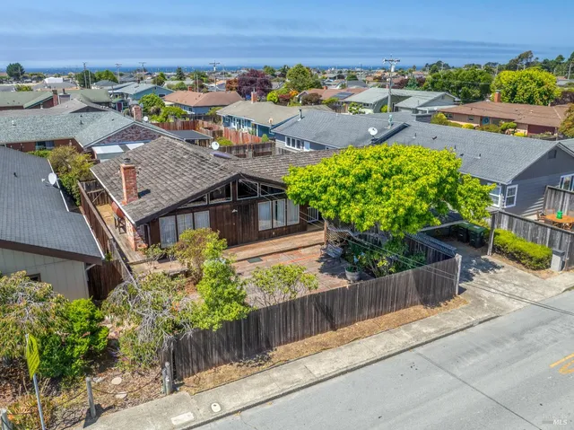 front view of a house with a large window