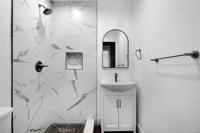 a bathroom with a sink and mirror