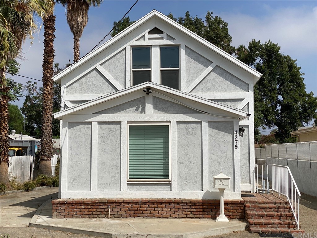 4275 Luther Street Riverside, CA 92506 - Photo 1 of 1 a front view of a house with a yard