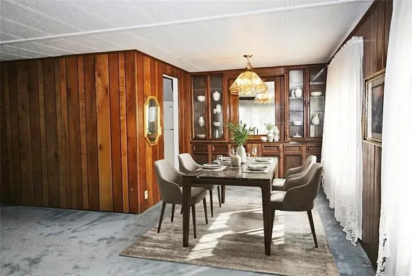 a view of a dining room with furniture window and outside view