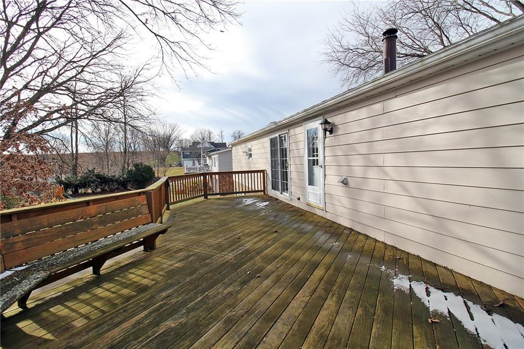 478 Cecil-Henderson Road Cecil, PA 15321 - Photo 21 of 26 a view of a balcony with wooden floor and fence