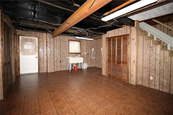 a view of a room with wooden walls