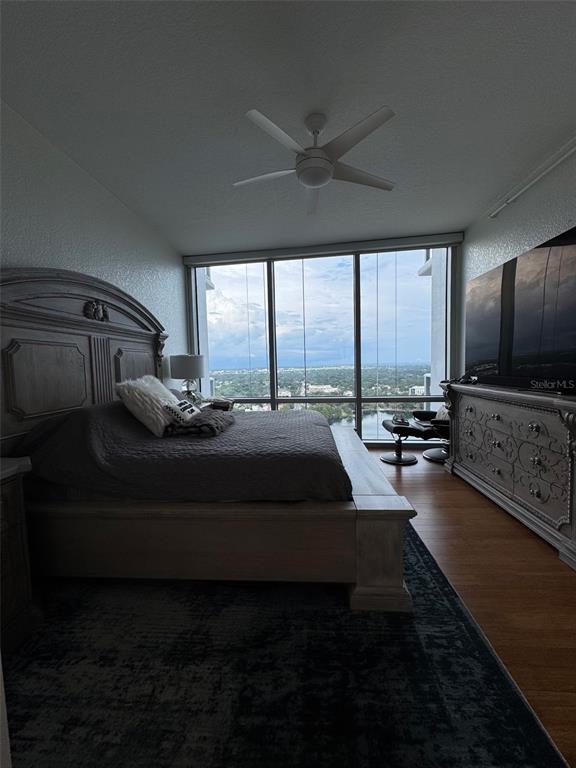 150 East Robinson Street, Unit 2409 Orlando, FL 32801 - Photo 16 of 26 a living room with furniture and a flat screen tv