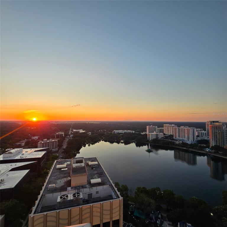 150 East Robinson Street, Unit 2409 Orlando, FL 32801 - Photo 7 of 26 a view of a lake with houses