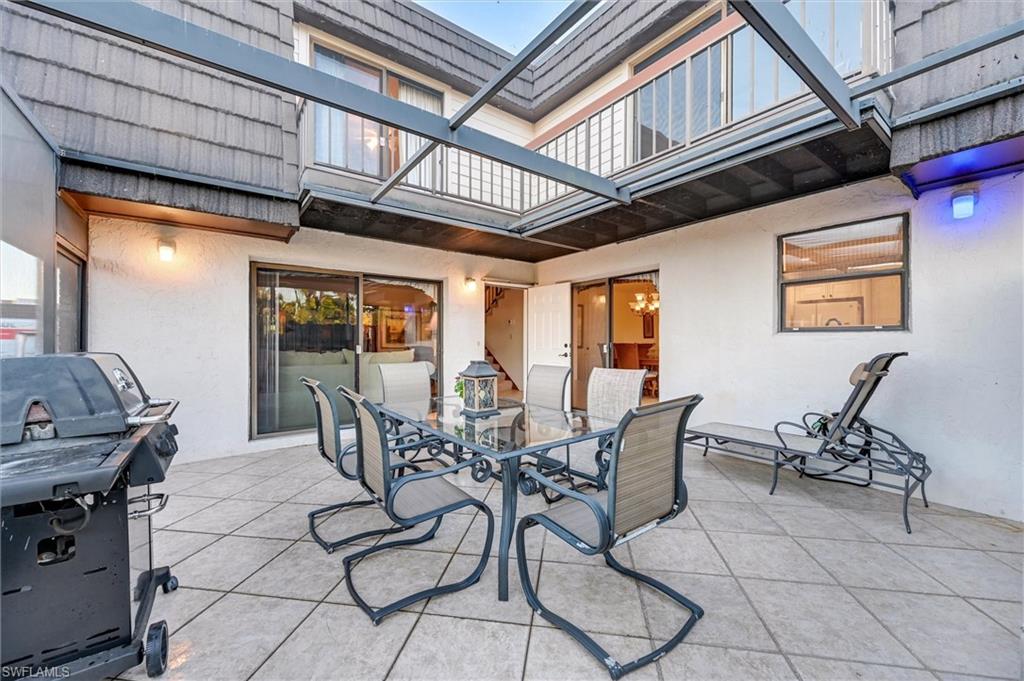 185 Lake Point Lane, Unit 8B Naples, FL 34112 - Photo 12 of 34 a view of a dining room with furniture window and outside view