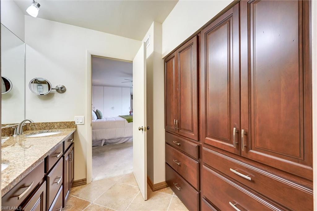 185 Lake Point Lane, Unit 8B Naples, FL 34112 - Photo 23 of 34 a view of bathroom with a sink and mirror