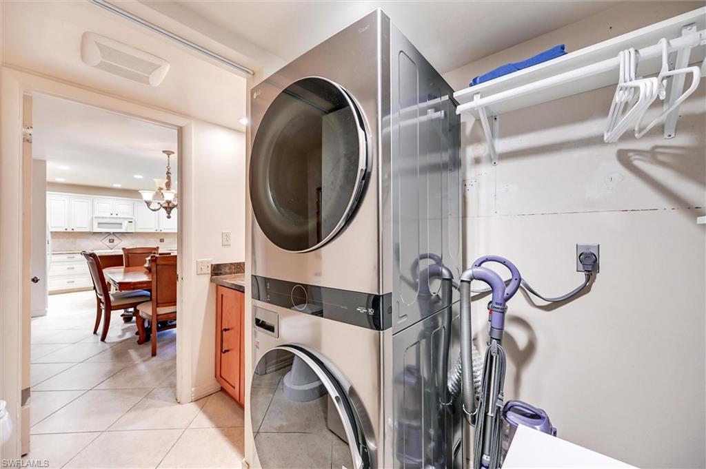 185 Lake Point Lane, Unit 8B Naples, FL 34112 - Photo 30 of 34 a view of a livingroom with furniture and windows