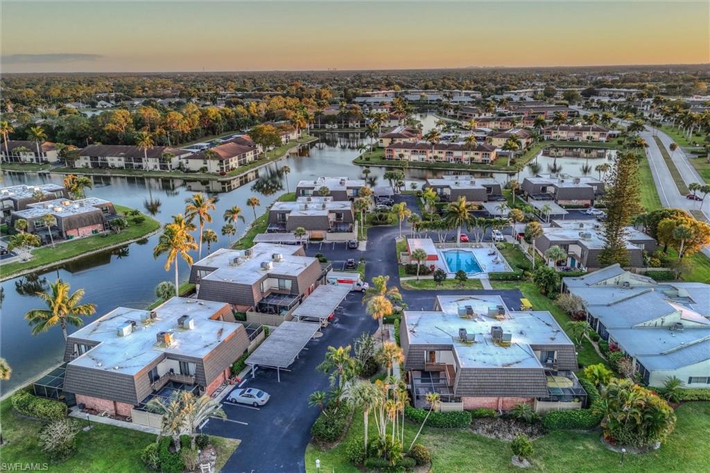 185 Lake Point Lane, Unit 8B Naples, FL 34112 - Photo 32 of 34 an aerial view of a city with lots of residential buildings ocean and mountain view in back