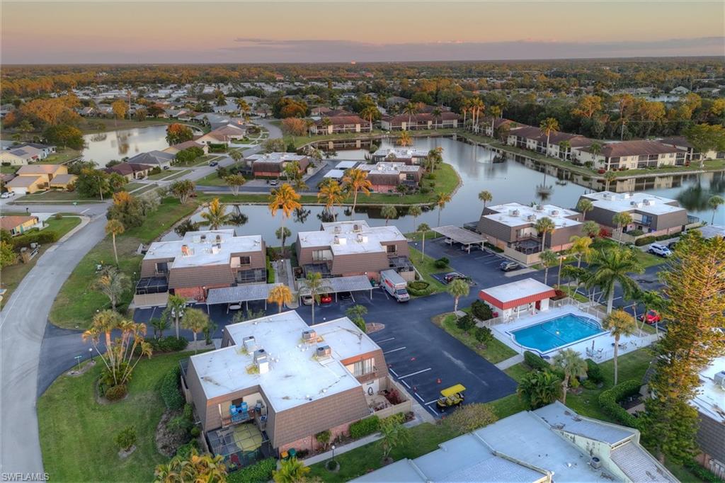 185 Lake Point Lane, Unit 8B Naples, FL 34112 - Photo 33 of 34 an aerial view of a houses with a swimming pool