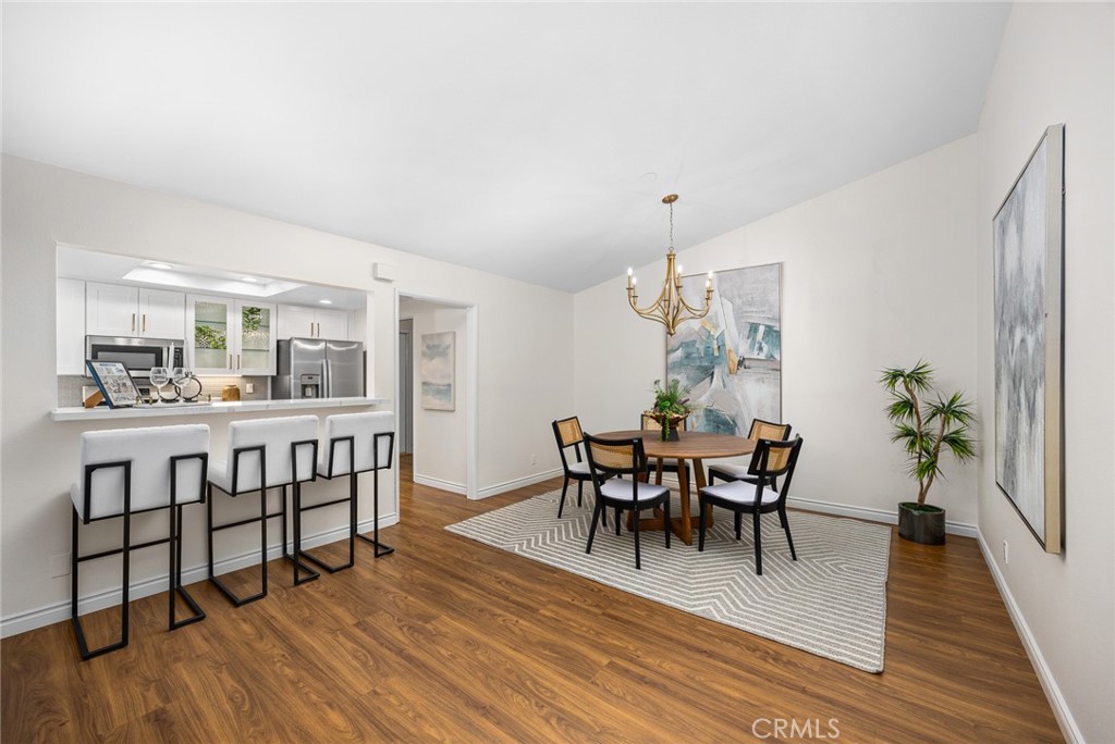 751 Ocean View Avenue, Unit A Monrovia, CA 91016 - Photo 12 of 29 a view of a dining room with furniture and wooden floor