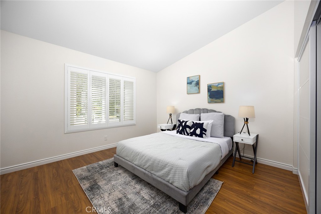 751 Ocean View Avenue, Unit A Monrovia, CA 91016 - Photo 17 of 29 a bedroom with a bed and wooden floor