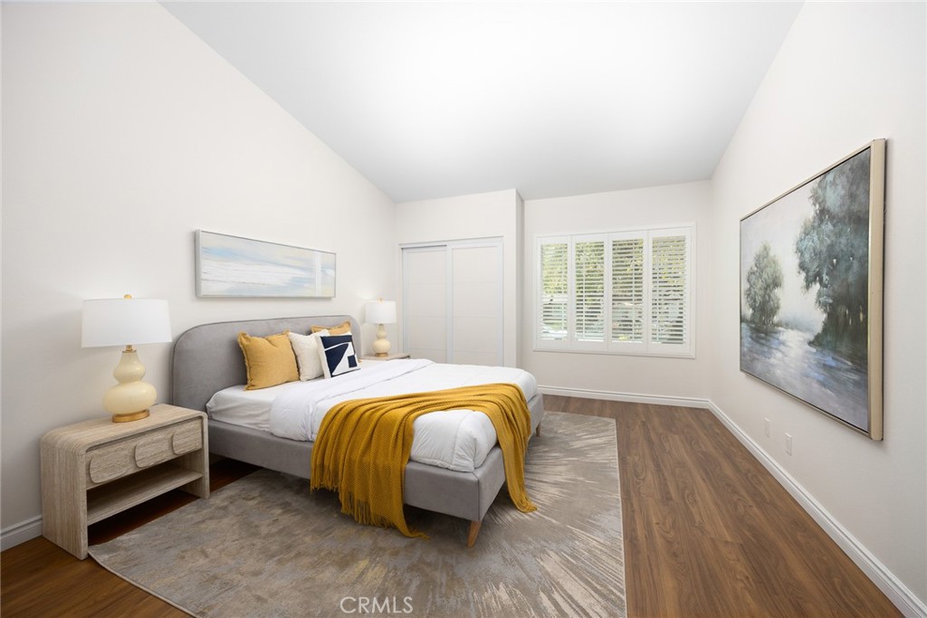 751 Ocean View Avenue, Unit A Monrovia, CA 91016 - Photo 20 of 29 a bedroom with a bed and wooden floor