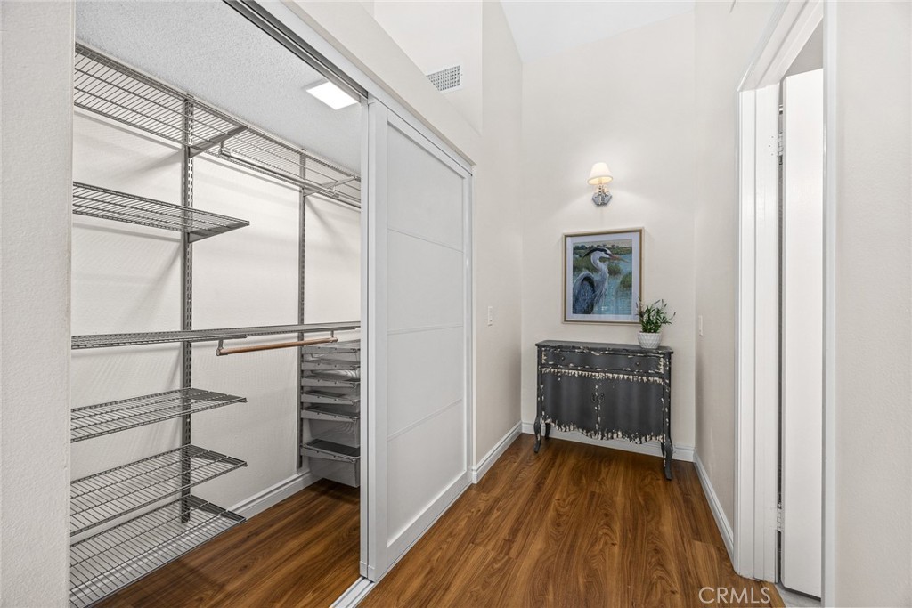751 Ocean View Avenue, Unit A Monrovia, CA 91016 - Photo 22 of 29 a view of a hallway and wooden floor with a cabinet