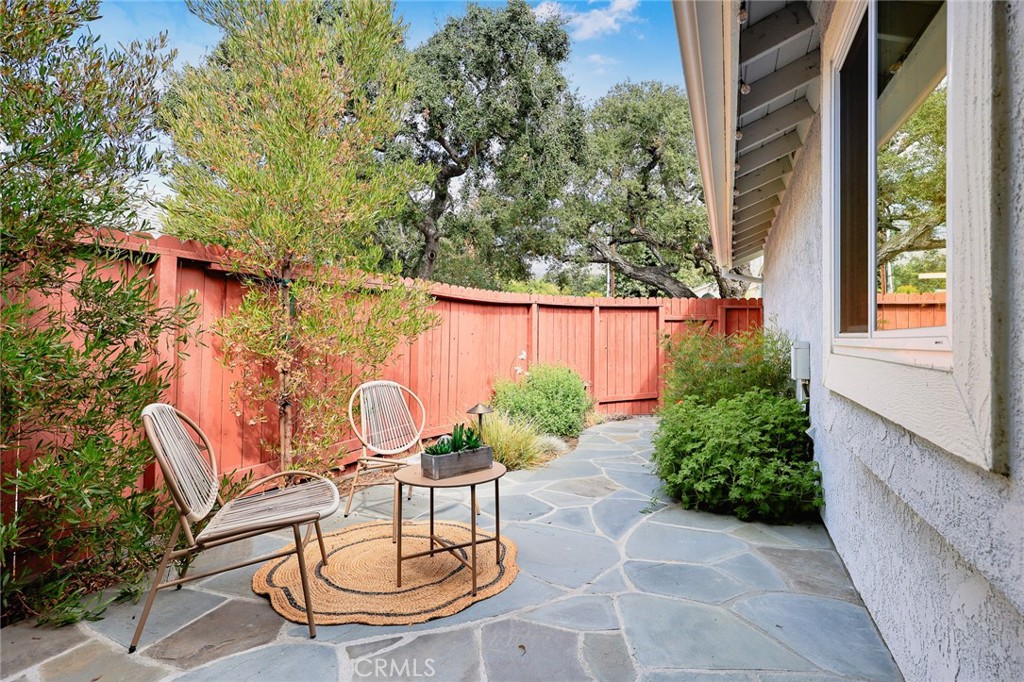 751 Ocean View Avenue, Unit A Monrovia, CA 91016 - Photo 24 of 29 a view of a chair and table in backyard of the house