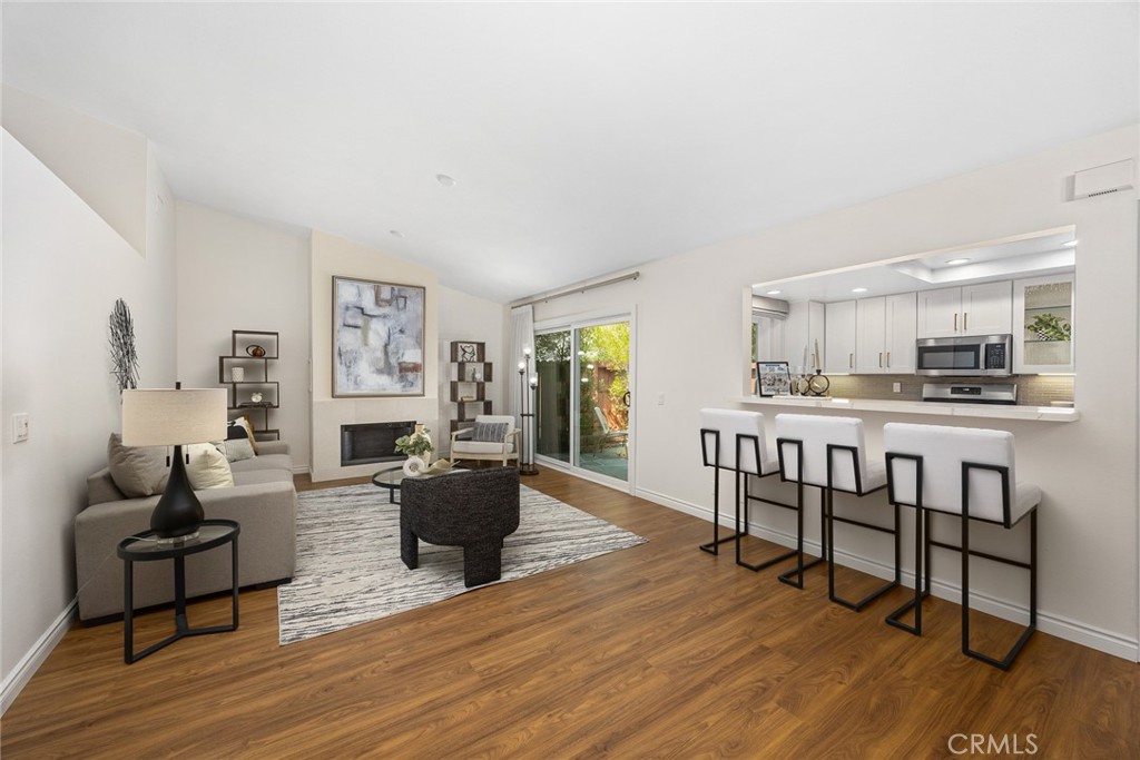 751 Ocean View Avenue, Unit A Monrovia, CA 91016 - Photo 8 of 29 a living room with furniture and a wooden floor