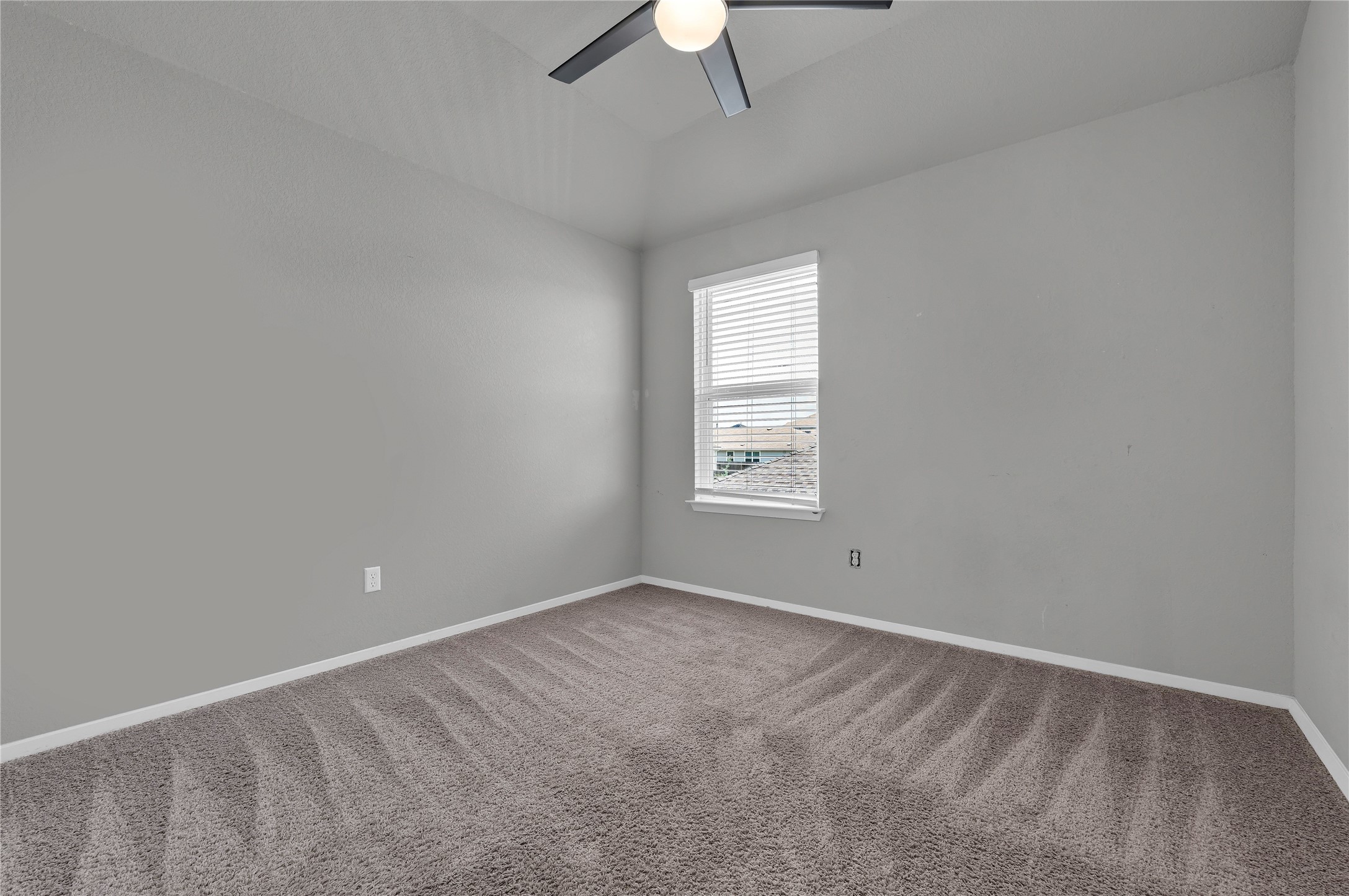 101 Crescent Street Georgetown, TX 78626 - Photo 25 of 39 Bedroom #2 features vaulted ceilings and plush carpeting, creating a comfortable living space.