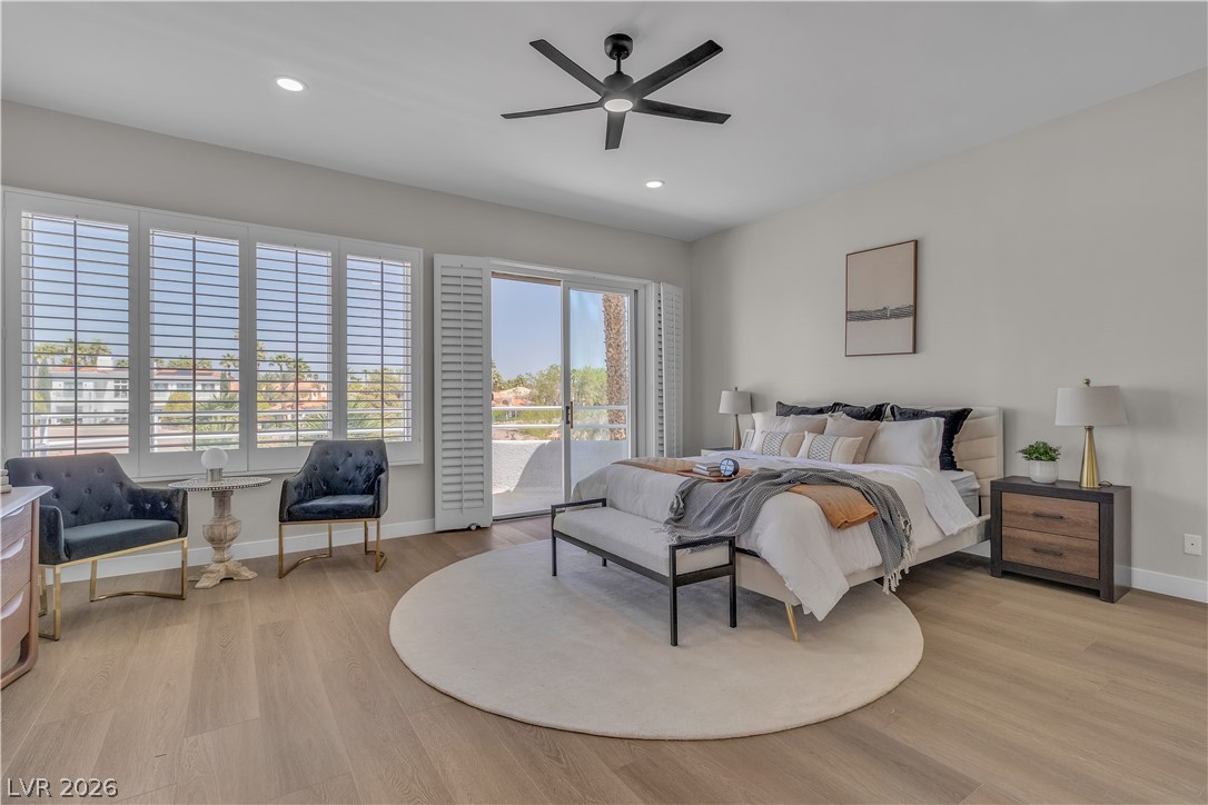 8848 Rainbow Ridge Drive Las Vegas, NV 89117 - Photo 28 of 43 Step into comfort with light wood flooring and a refreshing ceiling fan.