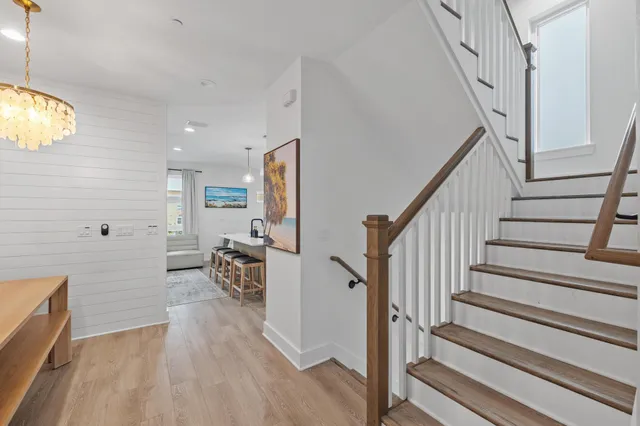 a large kitchen with stainless steel appliances kitchen island granite countertop a stove and a sink
