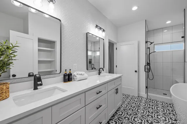 a bedroom with a bed and painting on the wall