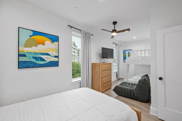 a bathroom with a double vanity sink toilet and shower