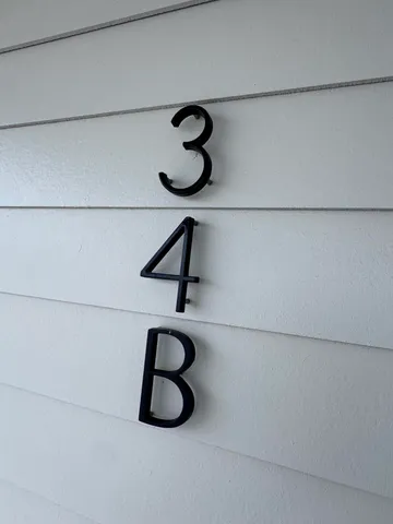 a kitchen with stainless steel appliances a stove a sink a refrigerator and cabinets