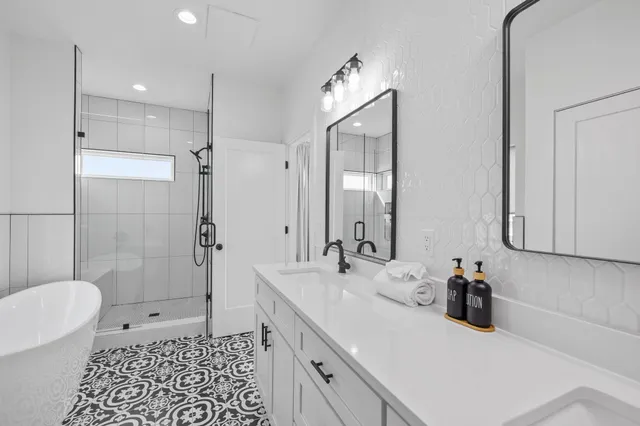 a large white bed in a white room