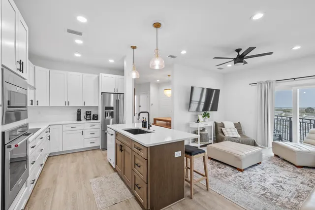 a kitchen with a table and chairs