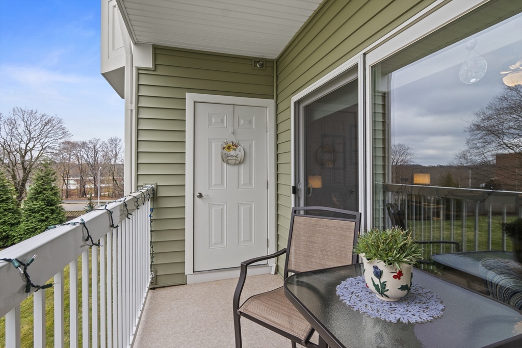 2 Talbot Way, Unit 2208 Westborough, MA 01581 - Photo 21 of 41 a view of a balcony with chairs and a potted plant