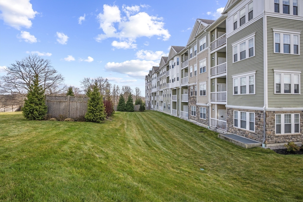 2 Talbot Way, Unit 2208 Westborough, MA 01581 - Photo 25 of 41 a view of a building with a garden