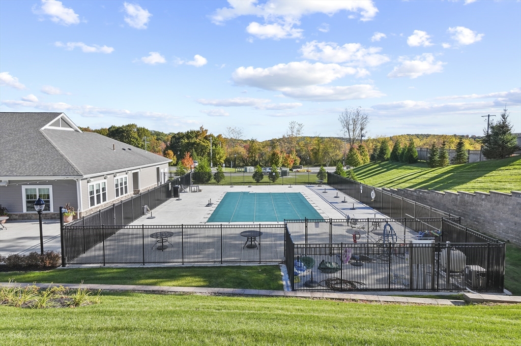 2 Talbot Way, Unit 2208 Westborough, MA 01581 - Photo 34 of 41 a view of a big yard next to a house