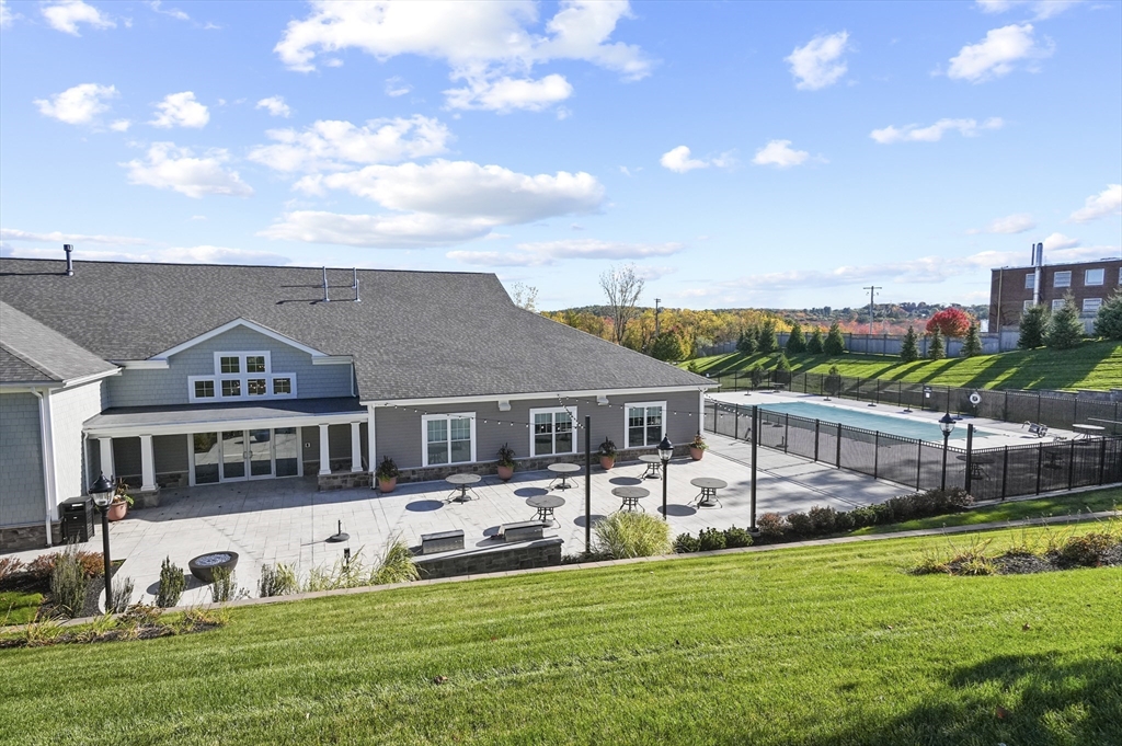 2 Talbot Way, Unit 2208 Westborough, MA 01581 - Photo 35 of 41 a view of a house with a big yard and large trees