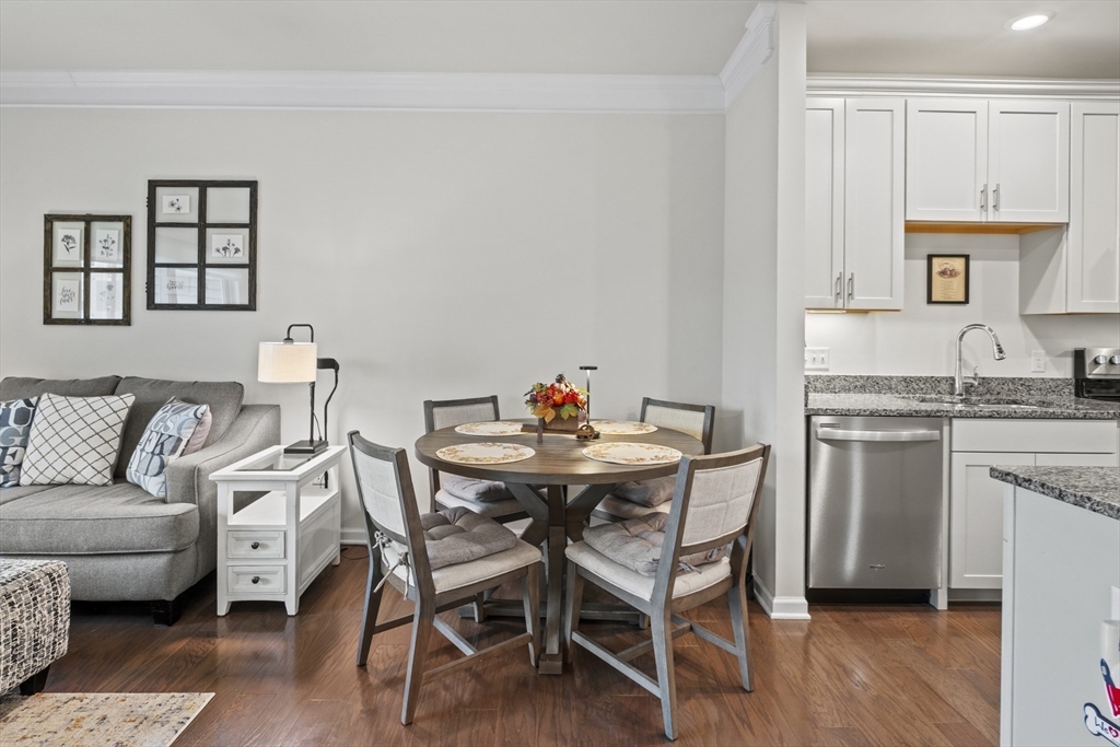 2 Talbot Way, Unit 2208 Westborough, MA 01581 - Photo 4 of 41 a kitchen with stainless steel appliances granite countertop a white table and chairs