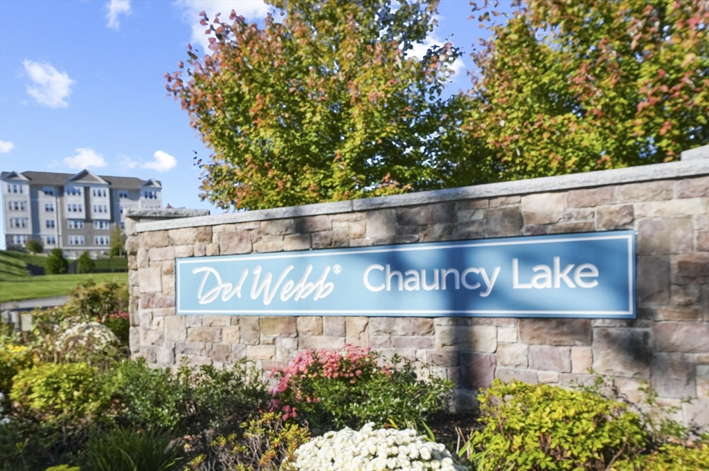 2 Talbot Way, Unit 2208 Westborough, MA 01581 - Photo 41 of 41 a street sign that is sitting in front of flowers