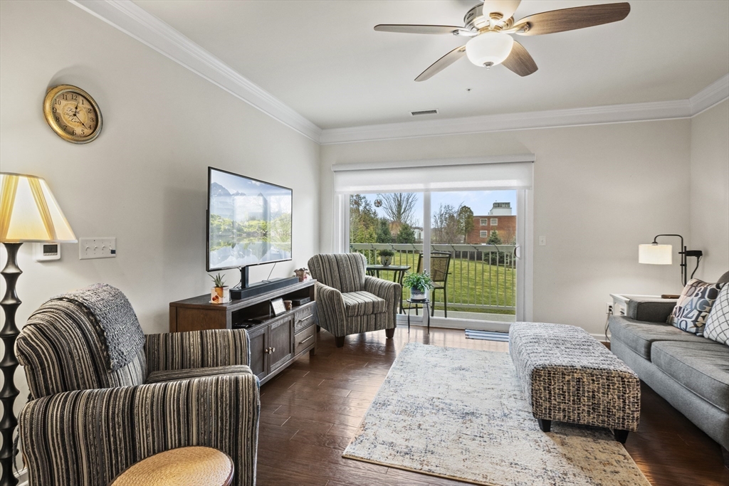 2 Talbot Way, Unit 2208 Westborough, MA 01581 - Photo 6 of 41 a living room with furniture and a floor to ceiling window