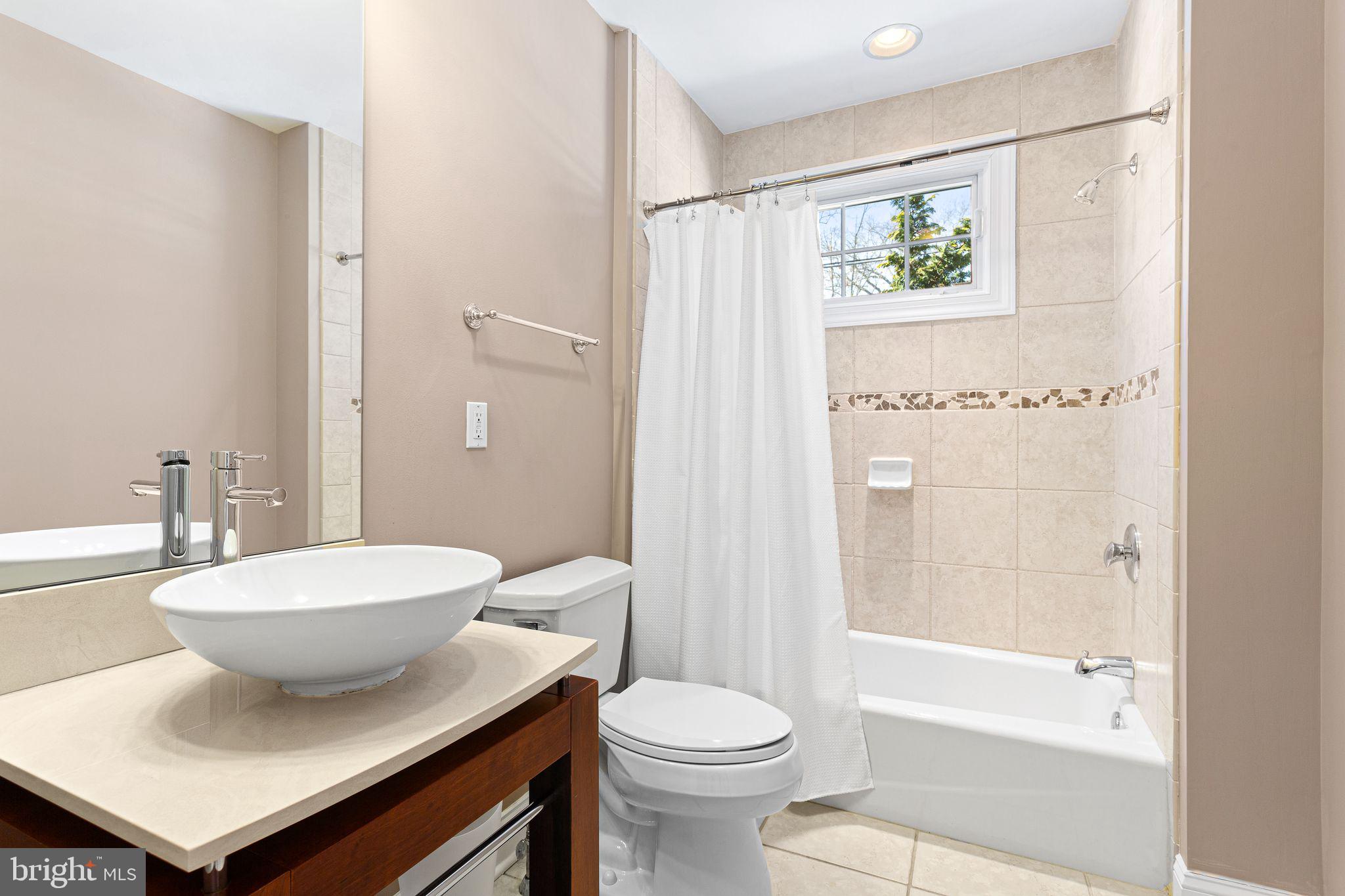 156 Ardmore Avenue Haddonfield, NJ 08033 - Photo 14 of 36 a bathroom with a sink a toilet and shower