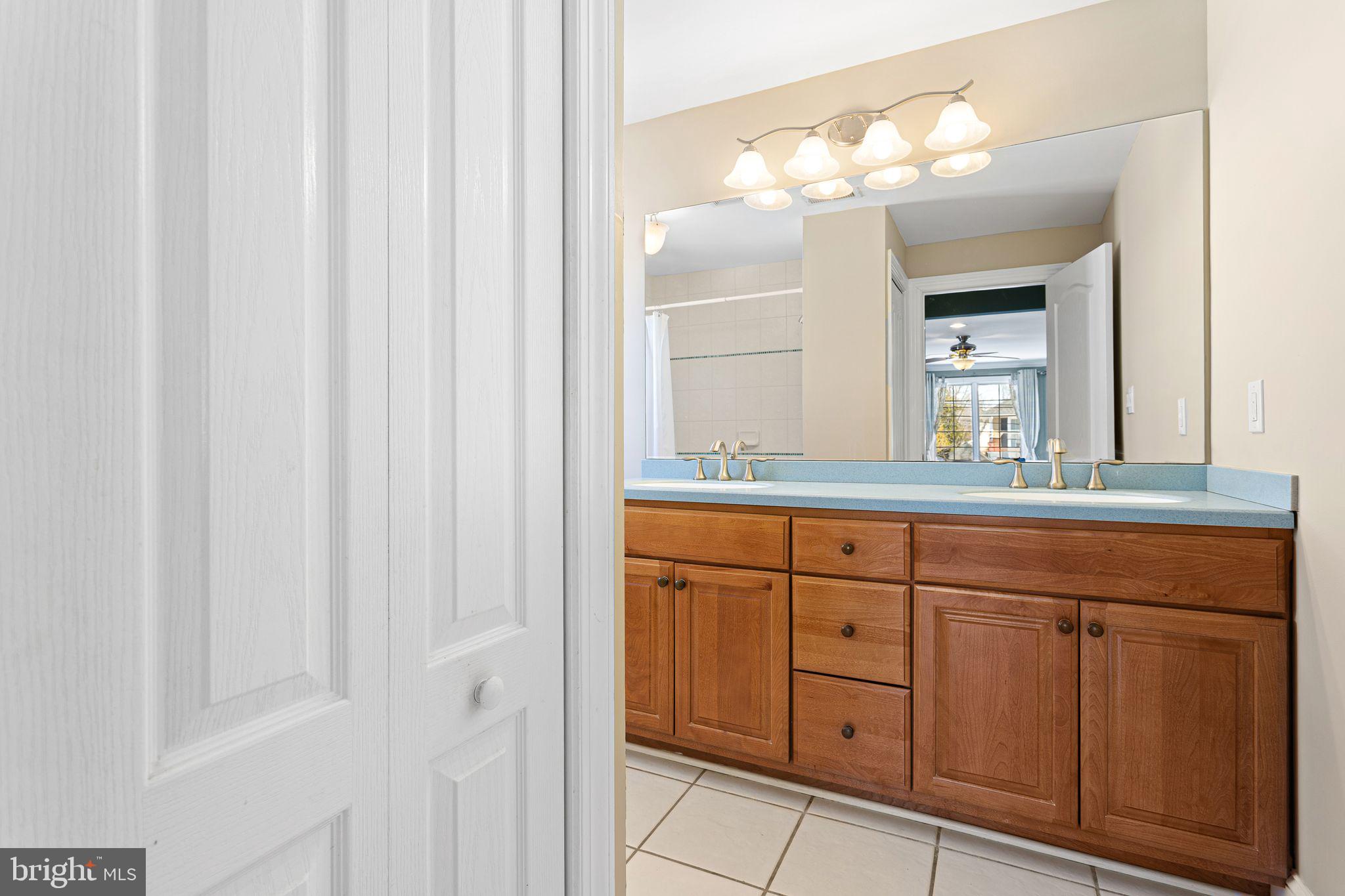 156 Ardmore Avenue Haddonfield, NJ 08033 - Photo 16 of 36 a bathroom with a sink and a mirror