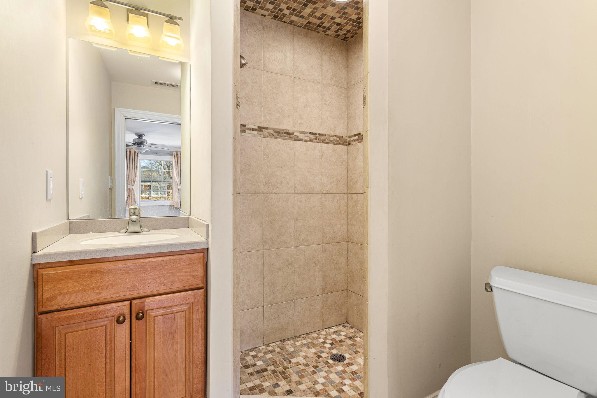 156 Ardmore Avenue Haddonfield, NJ 08033 - Photo 20 of 36 a bathroom with a granite countertop sink toilet and shower