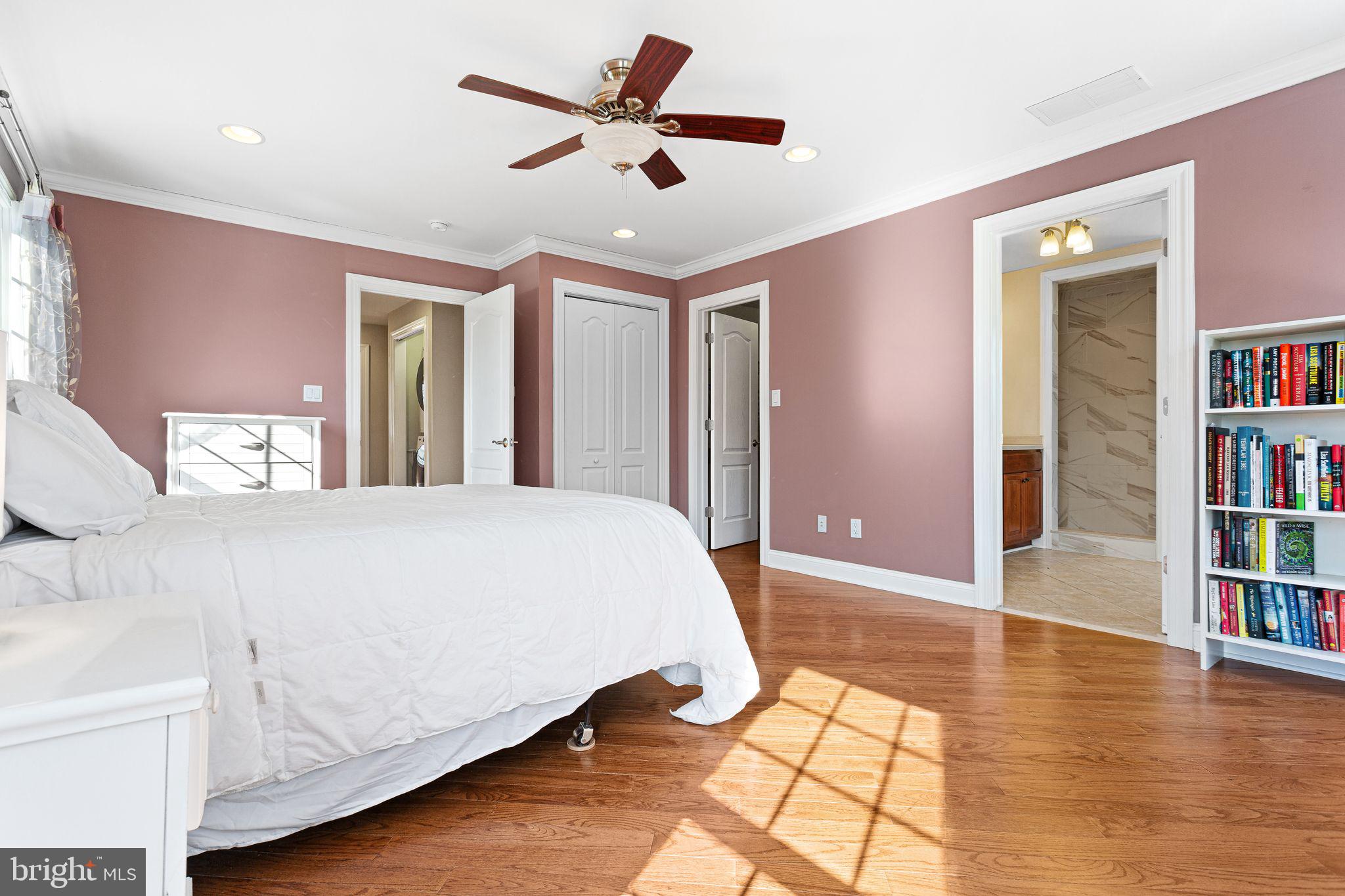 156 Ardmore Avenue Haddonfield, NJ 08033 - Photo 23 of 36 a spacious bedroom with a bed and a book shelf