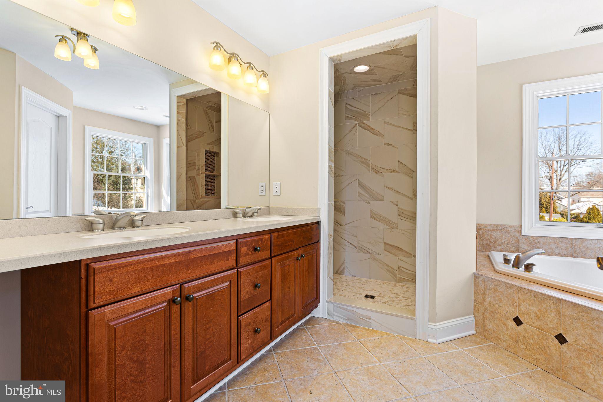 156 Ardmore Avenue Haddonfield, NJ 08033 - Photo 25 of 36 a spacious bathroom with double vanity sink a mirror and a bathtub