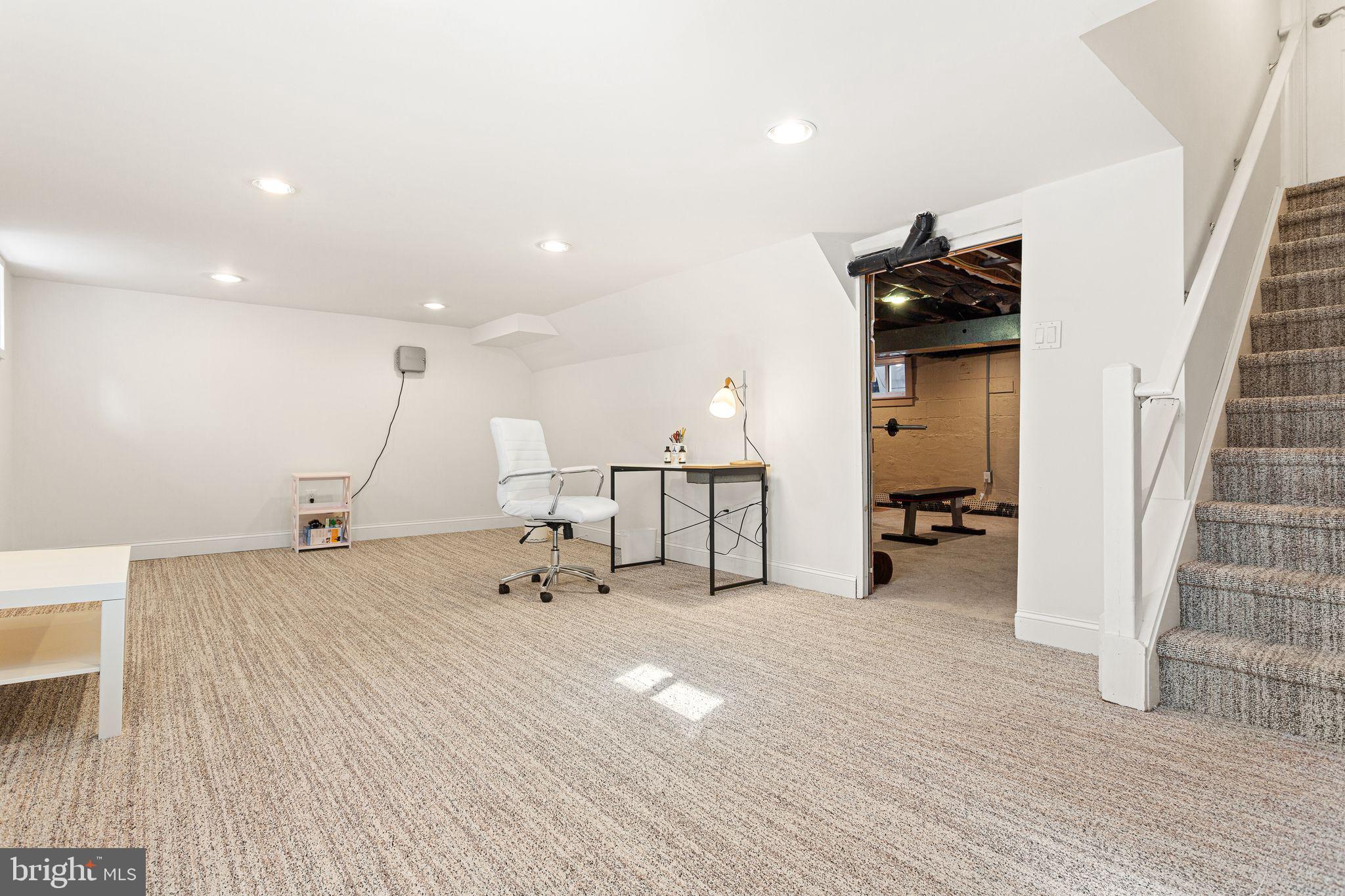 156 Ardmore Avenue Haddonfield, NJ 08033 - Photo 30 of 36 a room with lots of gym equipment and a wooden floor