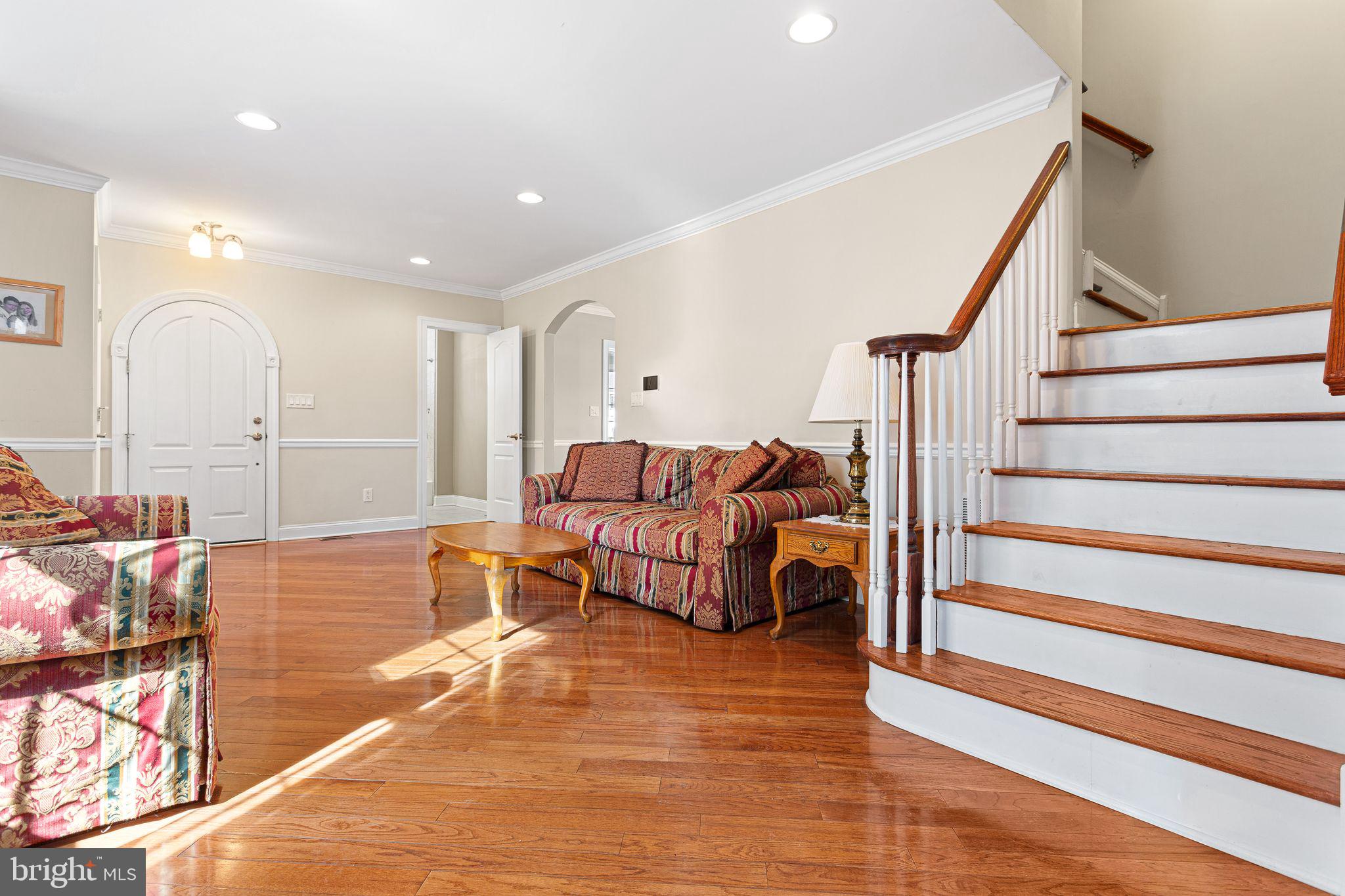 156 Ardmore Avenue Haddonfield, NJ 08033 - Photo 5 of 36 a living room with furniture and a chandelier